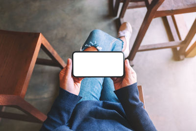 High angle view of man using mobile phone