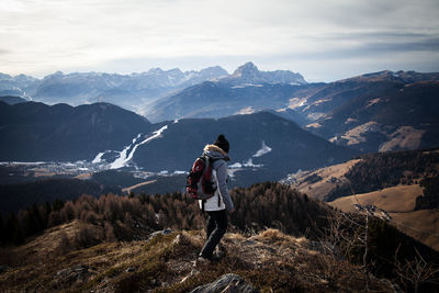 Full length of man standing on mountain against sky