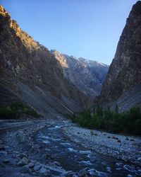 Scenic view of mountains against clear blue sky