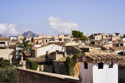 Buildings in city against sky