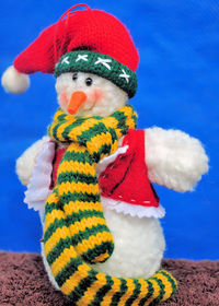 Close-up of stuffed snowman toy on table