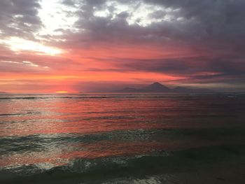 Scenic view of sea against cloudy sky
