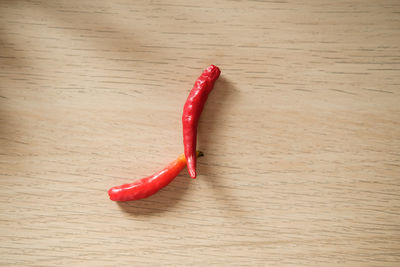 Close-up of red chili peppers on table