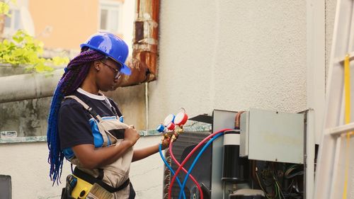 Rear view of man working at construction site