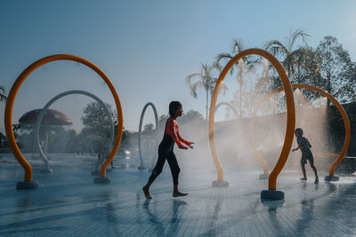 Children happily play at waterpak in taman tasik titiwangsa