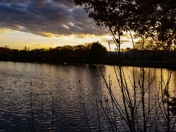 Scenic view of lake against sky during sunset