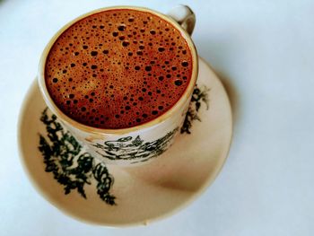 High angle view of coffee cup on table