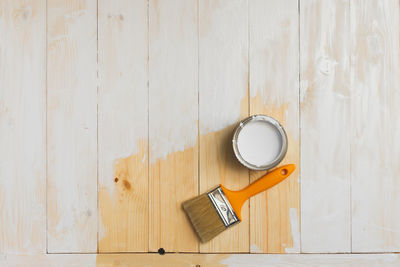 High angle view of coffee on table against white wall