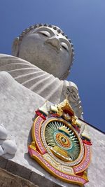 Low angle view of big buddha statue against sky