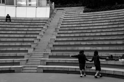 Children playing by steps at park