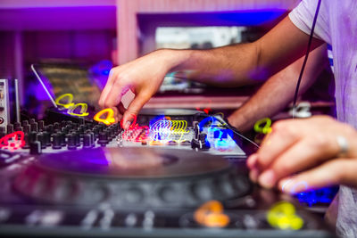 Midsection of man using mobile phone