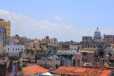 High angle view of buildings in city against sky