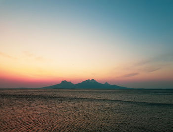 Scenic view of sea against sky during sunset