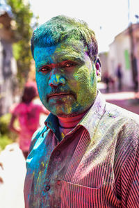 Close-up of man covered in paint powder