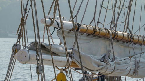 Close-up of sailboat in sea against sky