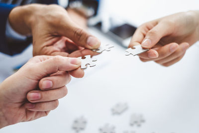 Close-up of hands holding paper