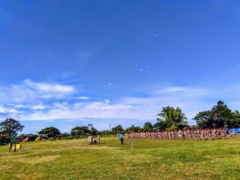 View of military training on field during sunny day