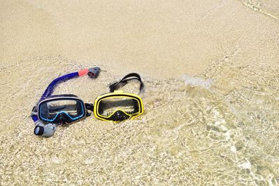 High angle view of shoes on sand