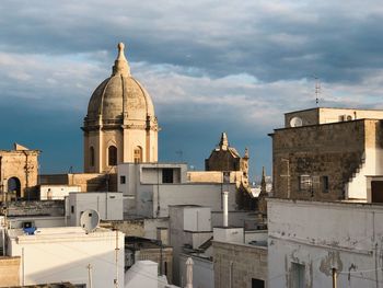 View of buildings in city against sky