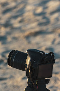 Close-up of camera on beach