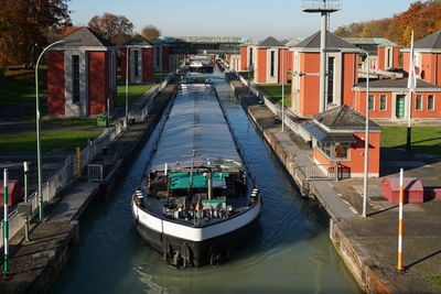 Barge in canal along built structures