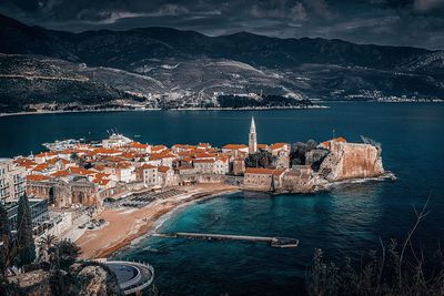 High angle view of city by sea