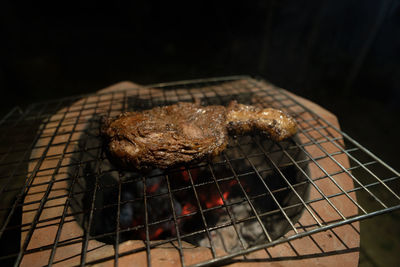 Close-up of meat on barbecue grill