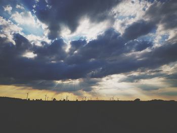 Silhouette landscape against sky during sunset