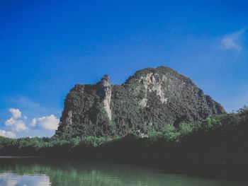 Scenic view of lake against blue sky