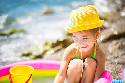 Smiling girl sitting in wadding pol