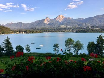 Scenic view of lake and mountains against sky