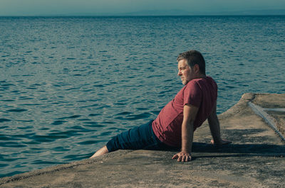 Depressed man on sea shore