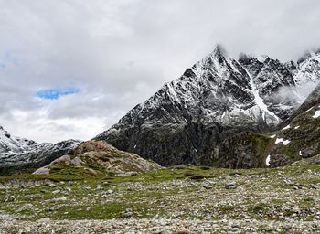 Scenic view of snowcapped mountains against sky