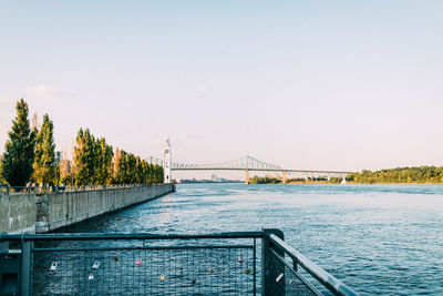 Bridge over river against clear sky