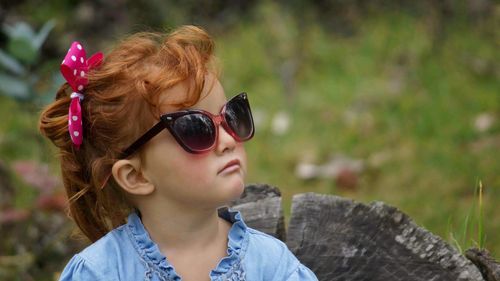 Close-up of girl wearing sunglasses