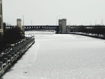 View of bridge in city against clear sky