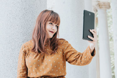 Young woman using mobile phone