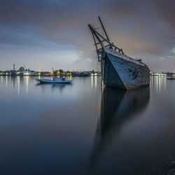 Boats moored at harbor