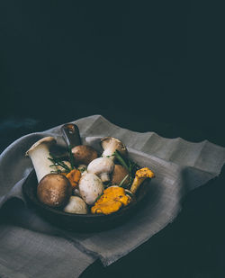 Close-up of food on table against black background