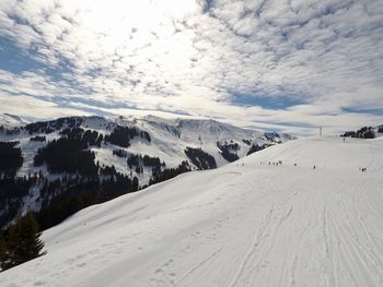 Scenic view of mountains against sky during winter