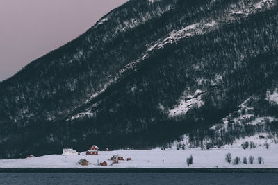 Scenic view of lake against sky during winter