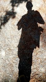 Low section of people standing on puddle