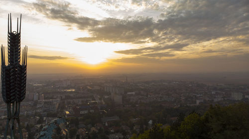 High angle view of buildings against sky during sunset