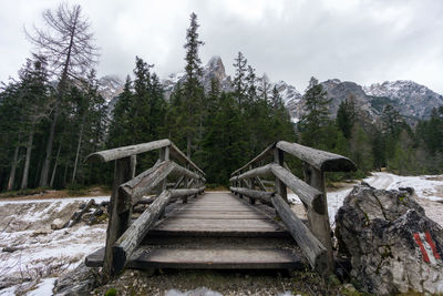 Wooden bridge against sky