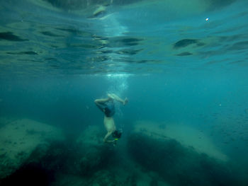 Person swimming in sea