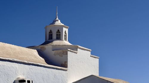 Low angle view of church against clear blue sky iglesia de nuestra señora de los dolores tinajo