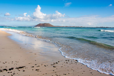 Scenic view of beach against sky