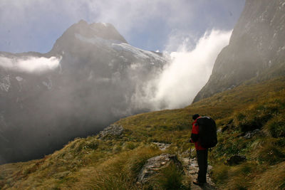 Rear view of hiker on mountain