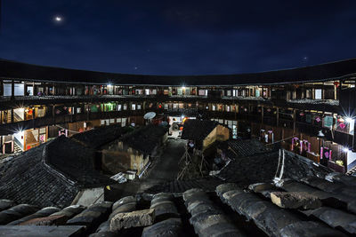 High angle view of buildings in city at night