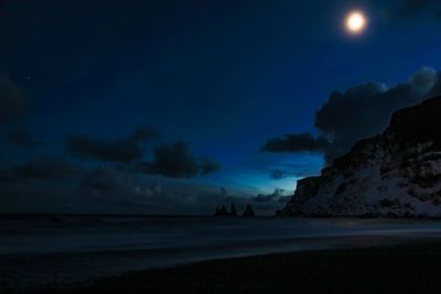 Scenic view of sea against sky at night